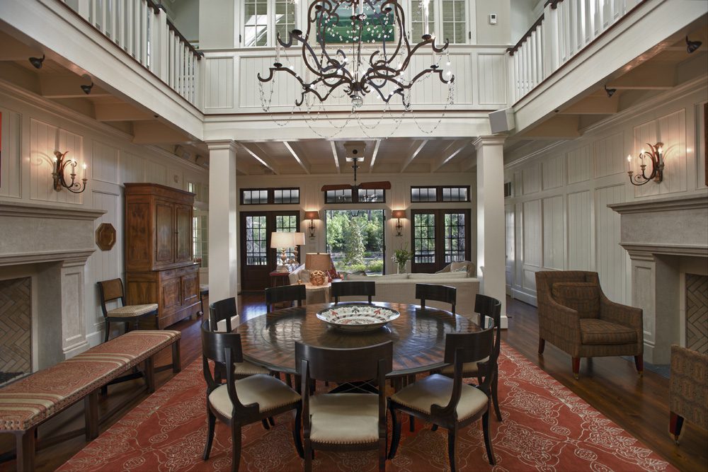 A large dining room with a table and chairs.