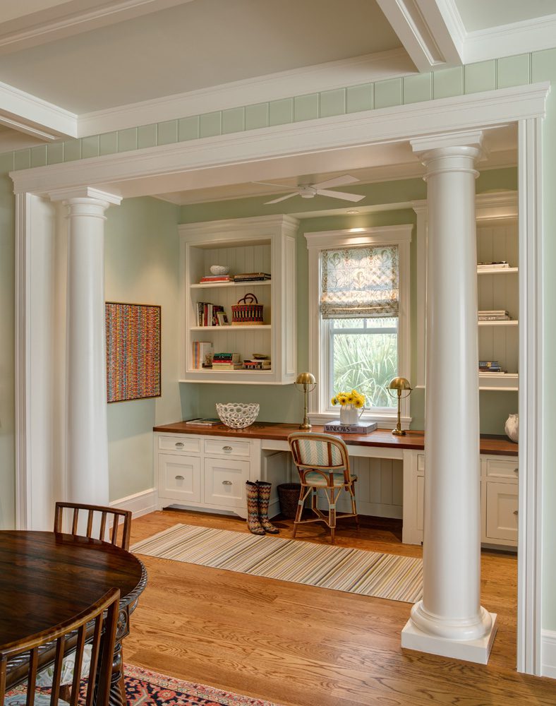 A room with two tables and a desk