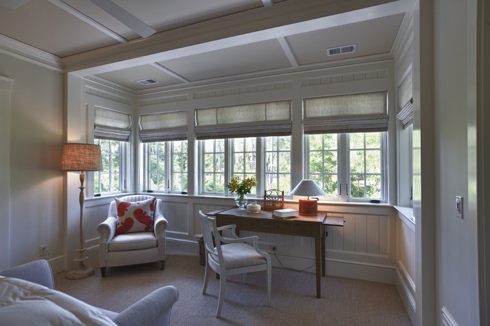 A living room with two chairs and a table