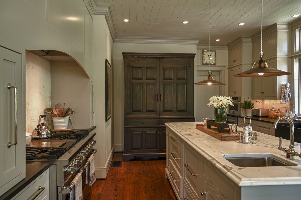 A kitchen with an island and cabinets in it