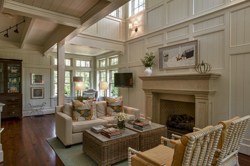 A living room with two couches and a fireplace.