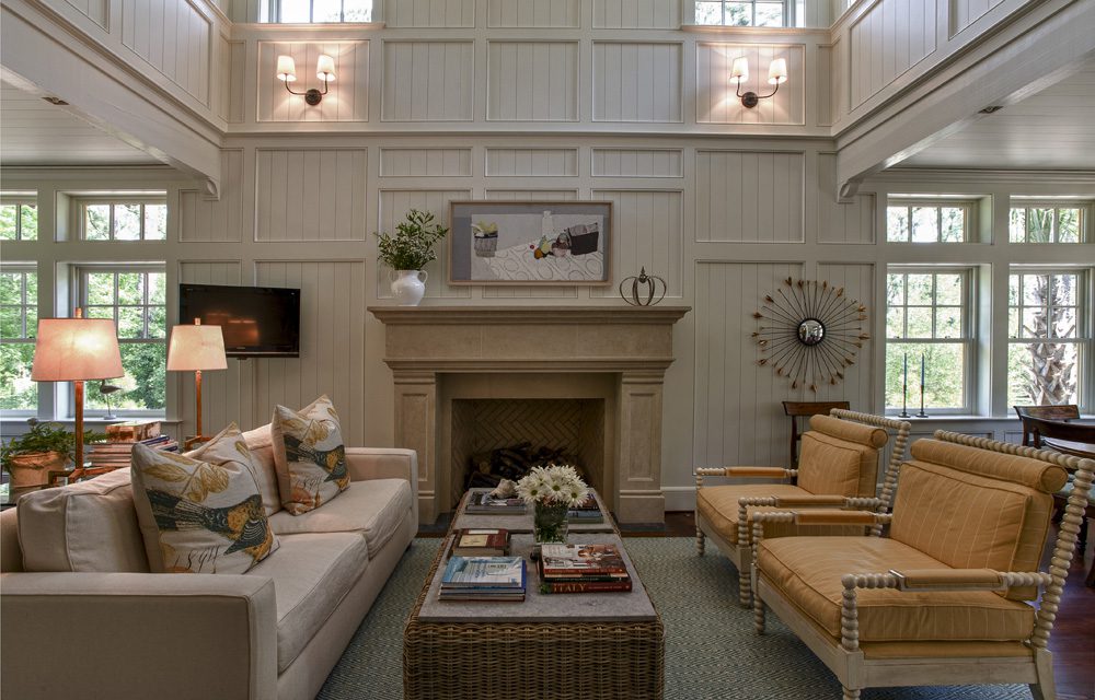 A living room with two chairs and a fireplace.