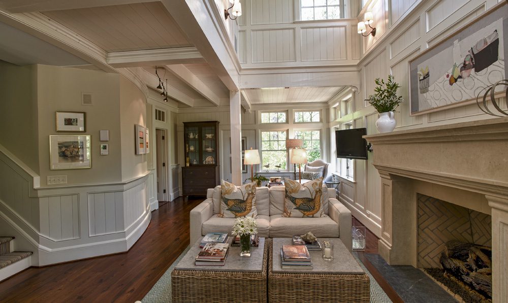 A living room with two couches and a fireplace.