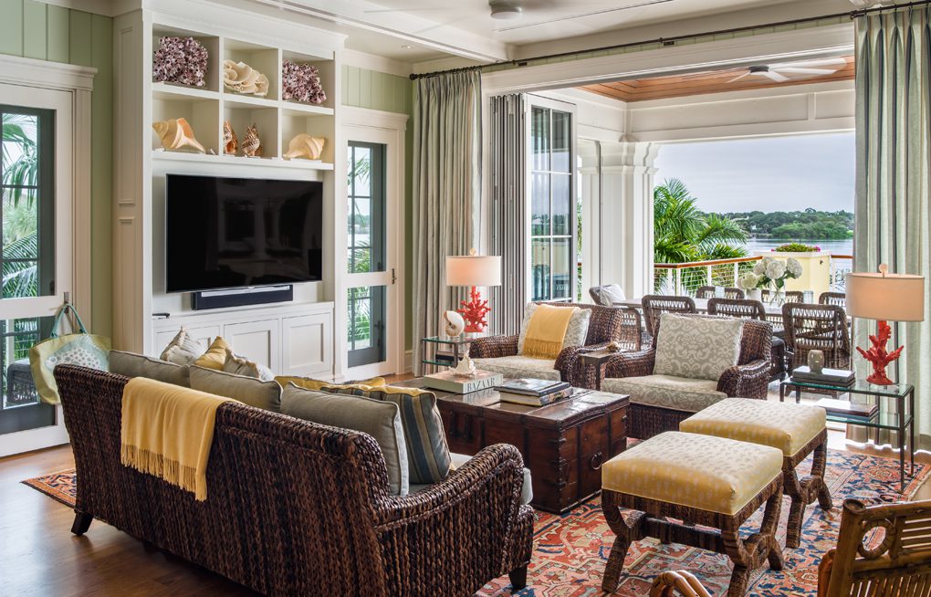 A living room with couches, chairs and tables.