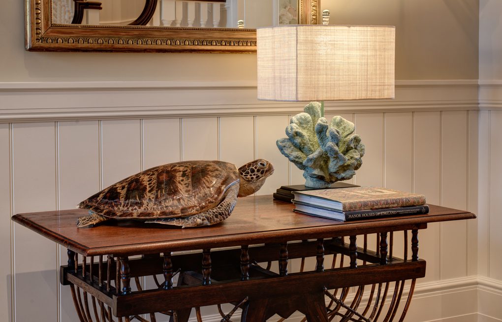 A turtle statue sitting on top of a table.